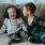 two young boys sitting on couch